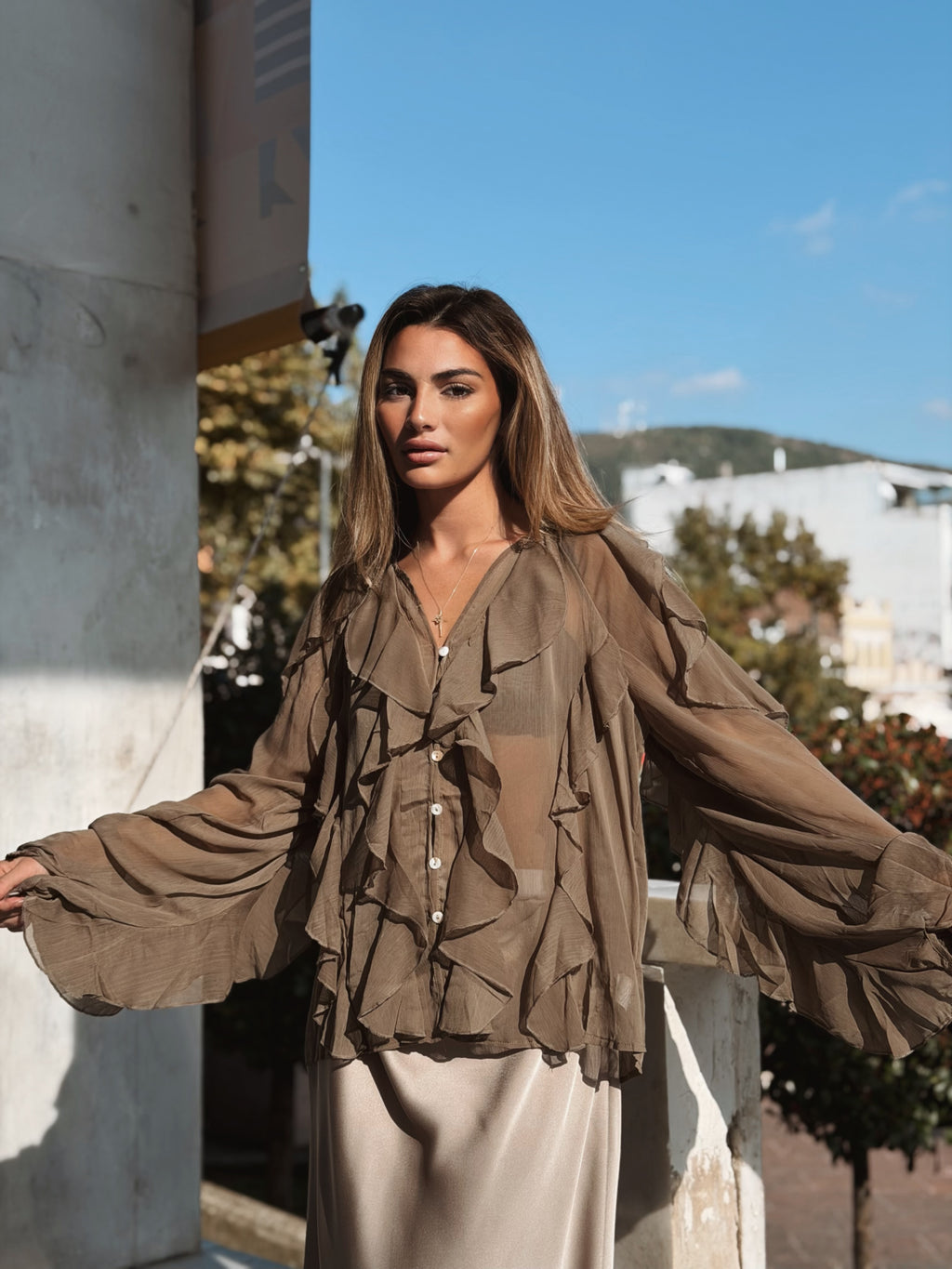 Volangblus med snäckknappar