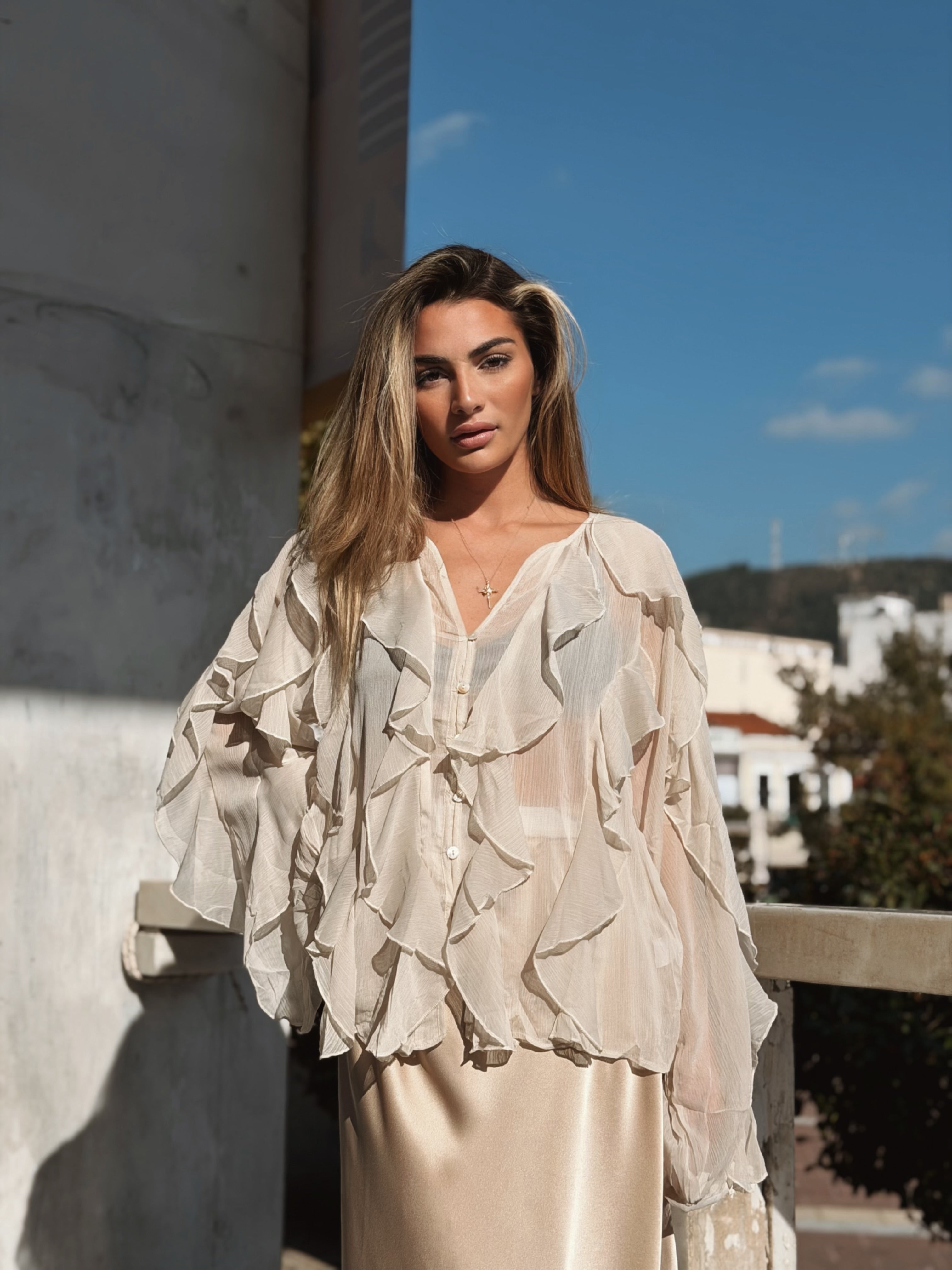 Volangblus med snäckknappar